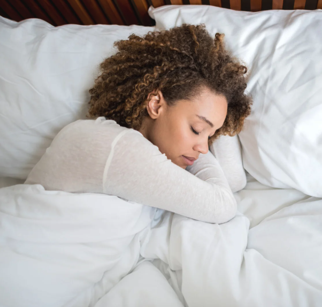 woman sleeping peacefully - recovery and rest for hypermobile patients